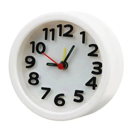 Malý kulatý analogový budík na cesty