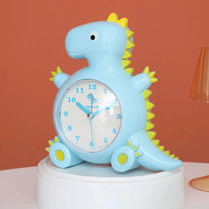 Dětský analogový budík ve tvaru dinosaura