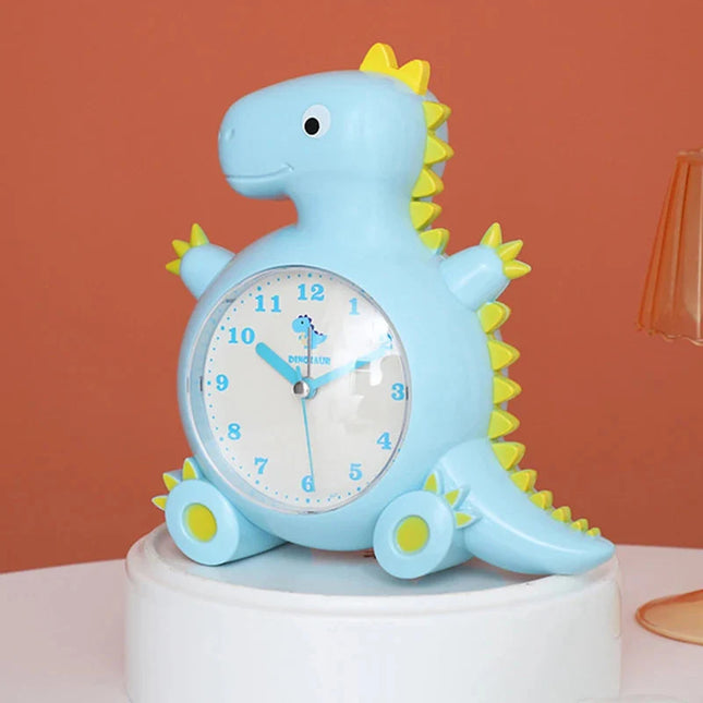 Dětský analogový budík ve tvaru dinosaura