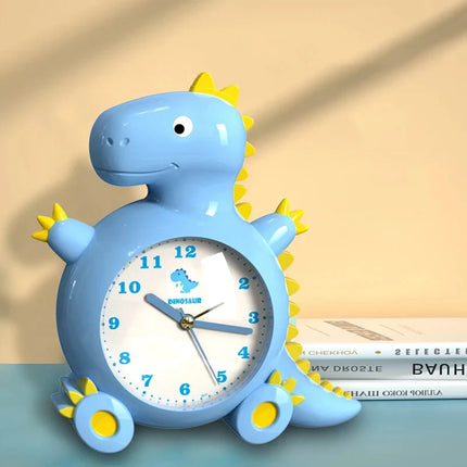 Dětský analogový budík ve tvaru dinosaura