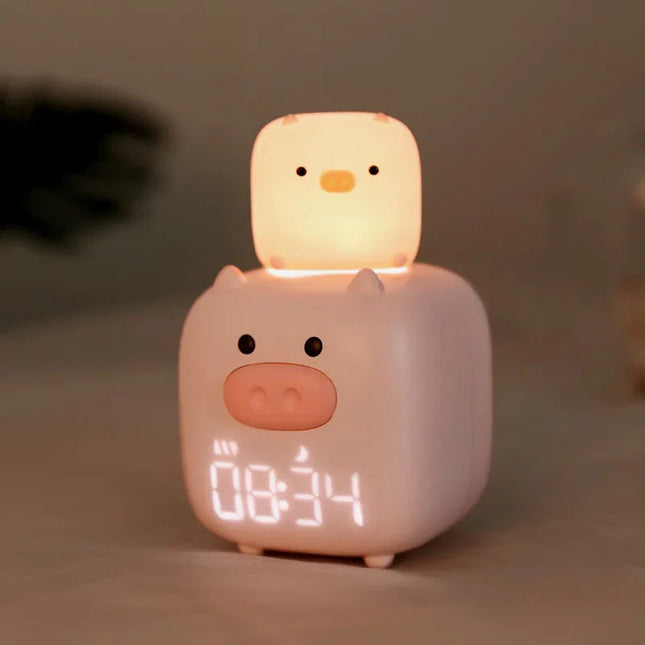 Růžový dětský budík ve tvaru prasátka