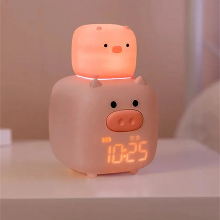 Růžový dětský budík ve tvaru prasátka