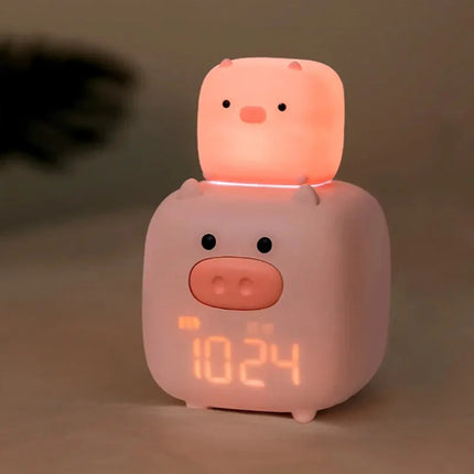 Růžový dětský budík ve tvaru prasátka